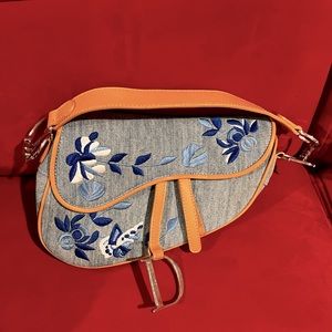 Not authentic Dior saddle bag. Denim with ten leather straps